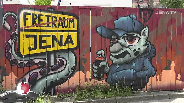 Streetart-Galerie: Am Bauzaun auf dem Inselplatz wird für Freiräume geworben